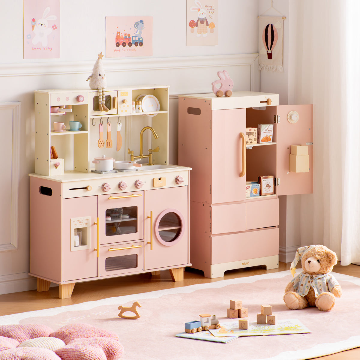 ROBUD Glowwood pink play kitchen and open refrigerator side by side, showing full storage and cooking area details.