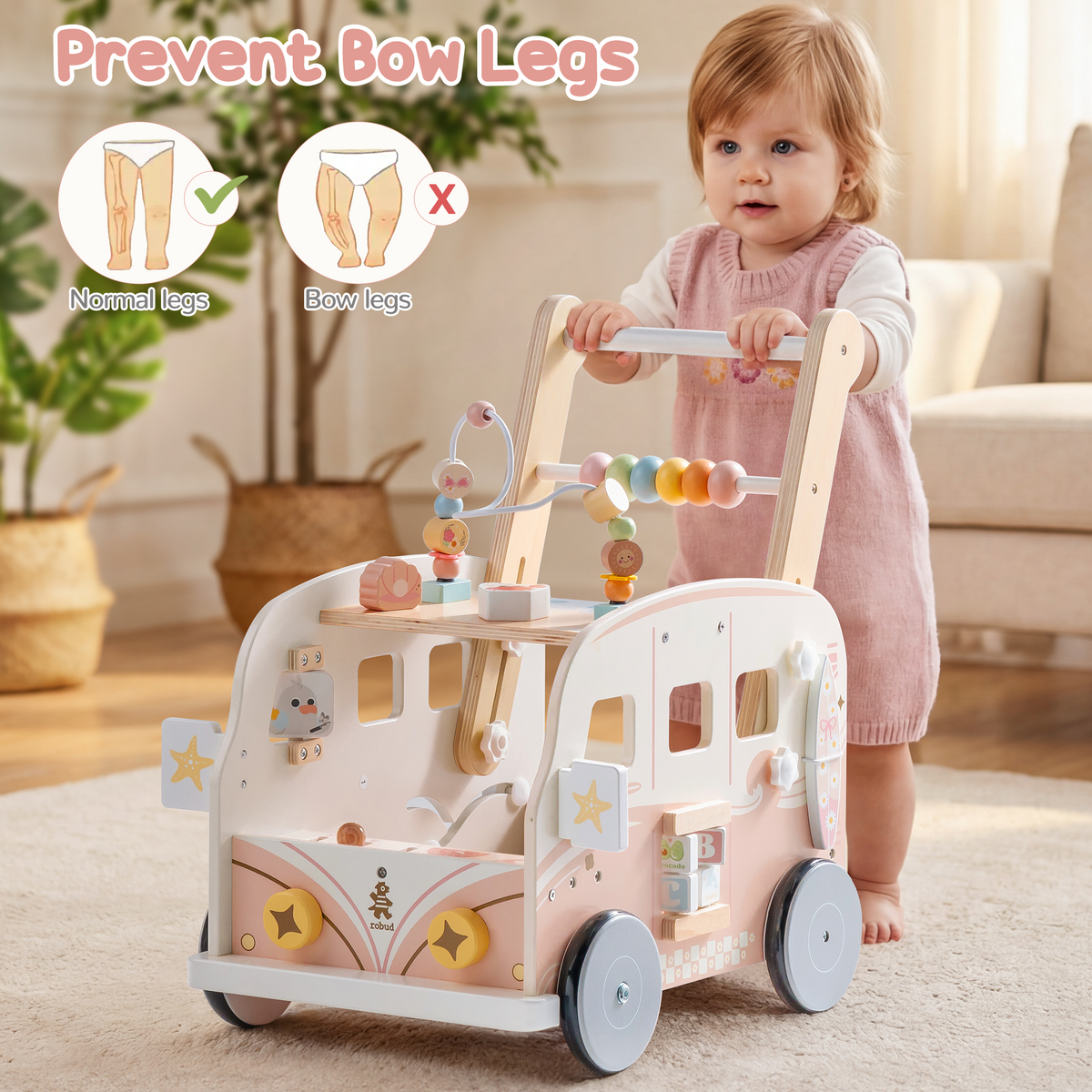 Baby girl pushes the ROBUD pink wooden bus walker across a living room rug while taking confident first steps.