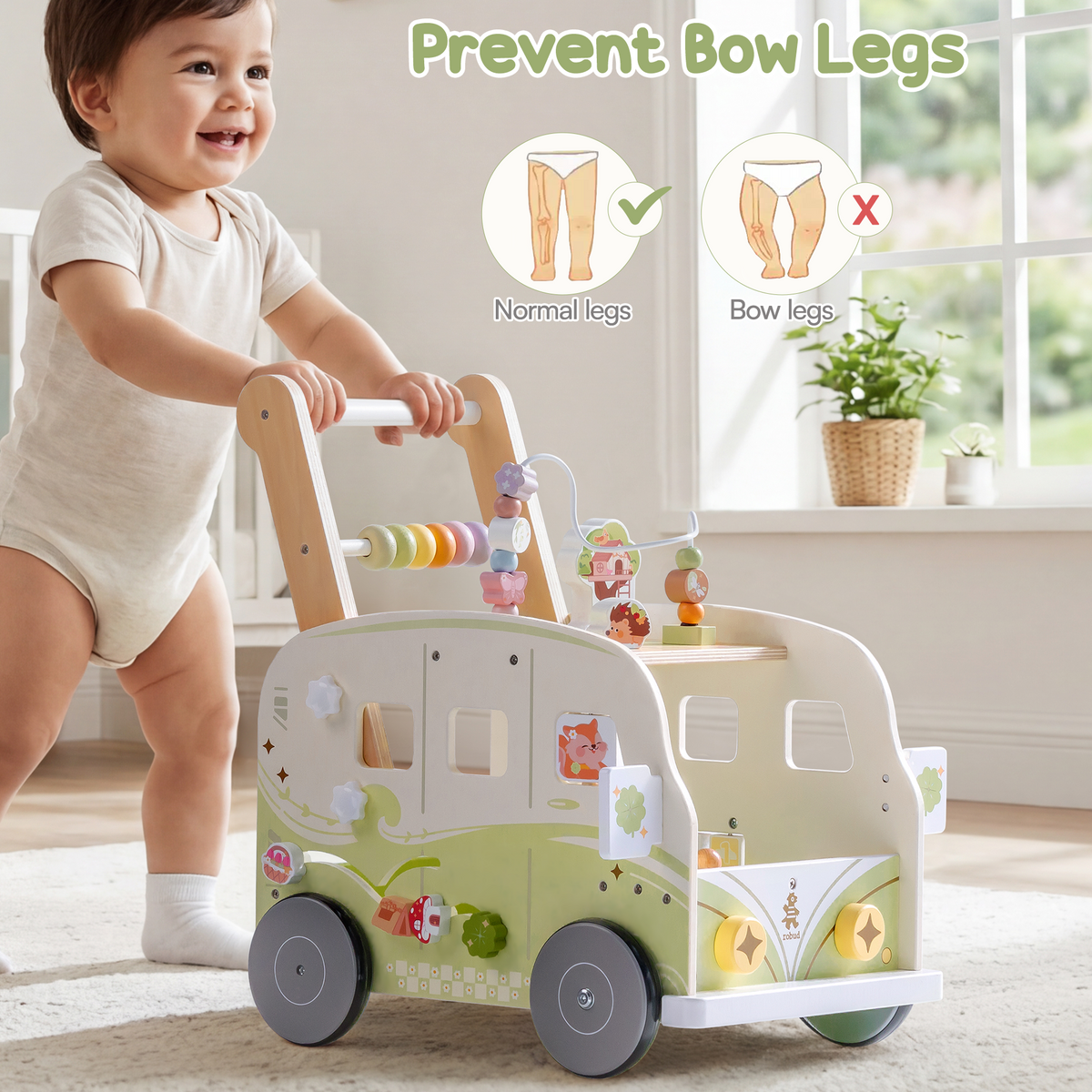 Baby pushes the ROBUD green forest vacation bus walker while a smiling mother sits beside on the floor cheering.