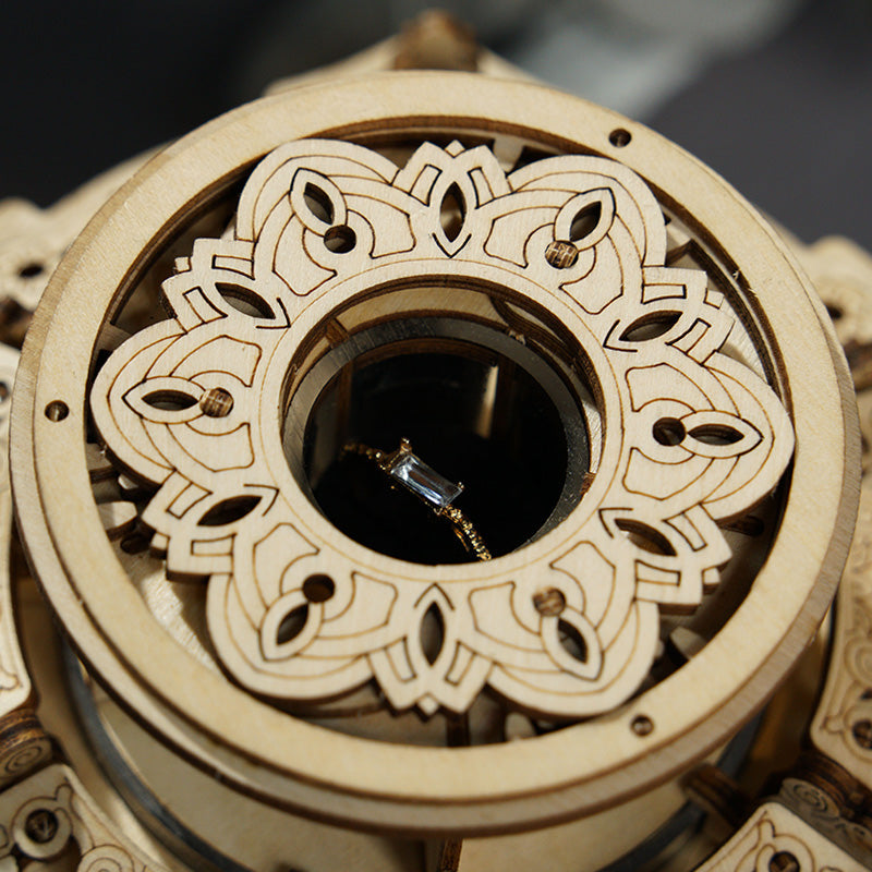 ROKR Secret Garden music box top view showing open circular lid with decorative laser-cut petal mechanism inside