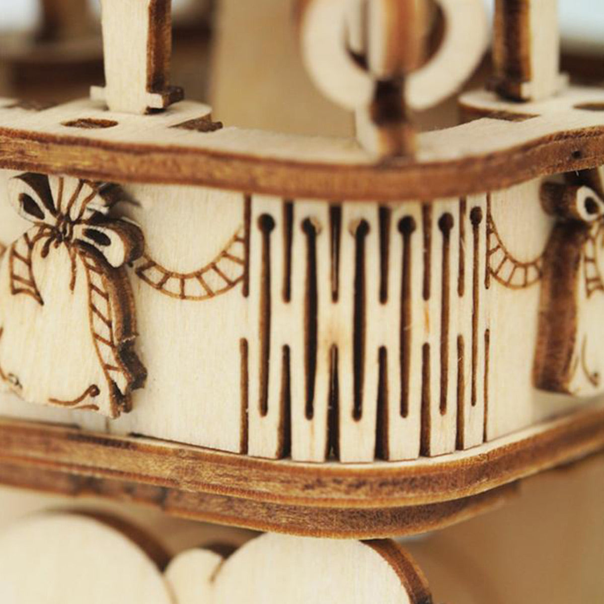Close-up of laser-engraved rope and arch details on the ROKR Romantic Note wall clock wooden base tier