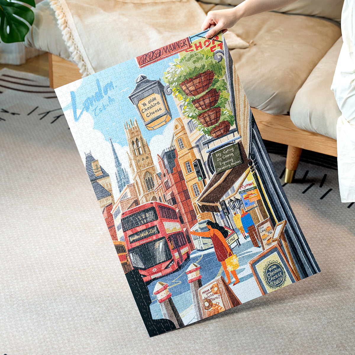 Person holding completed Rolife Walk in London PT003 jigsaw puzzle upright showing full illustrated London street artwork