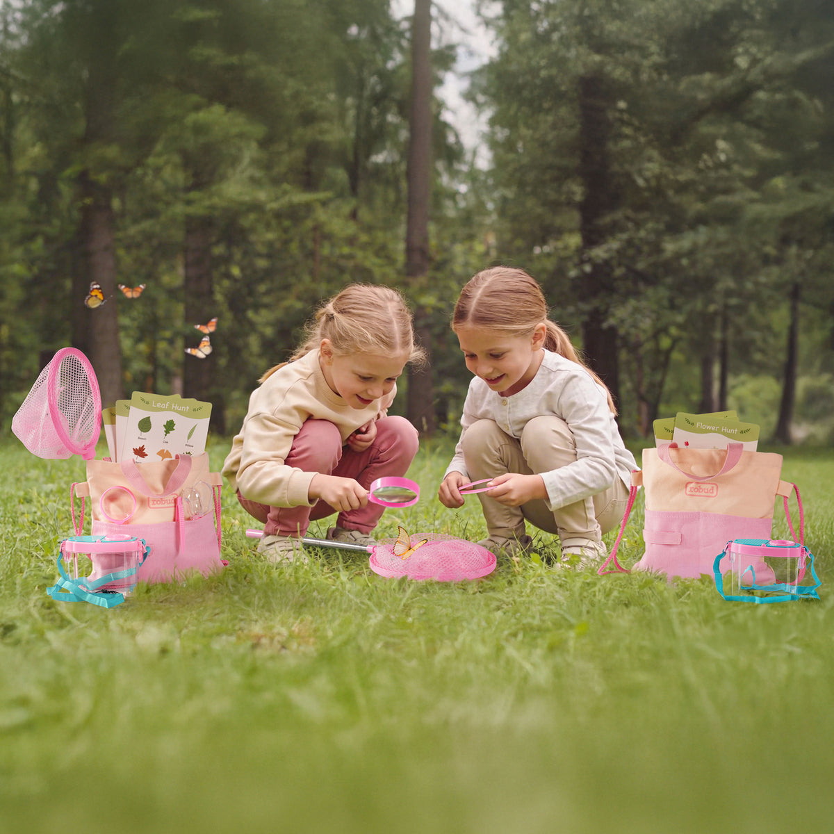 Girl in pink with ROBUD pink magnifying glass in sunlit green garden with insects illustrated in corner of frame