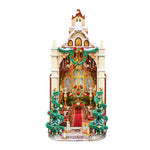 Rolife miniature Christmas cathedral model with snow-dusted roof, arched entrance, wreath, twin decorated trees and lit interior.