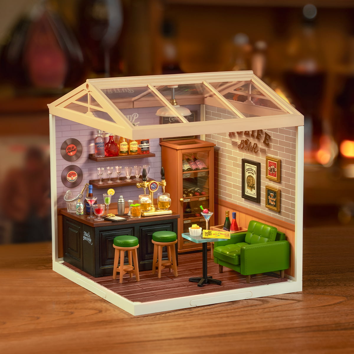 Rolife Leisurely Cheers Bar DW012 miniature bar room with greenhouse style glass roof showing full interior with warm lighting and green sofa