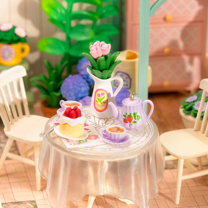 Rolife Super Creator 3 in 1 L Shape DIY miniature dollhouse kit, hands assembling laser-cut wooden pieces