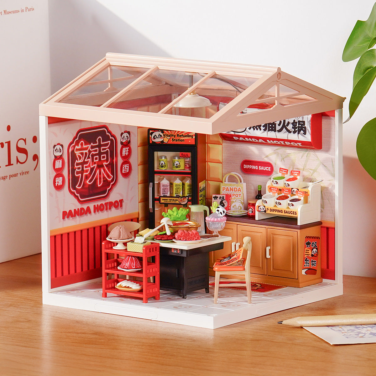 Rolife Panda Hot Pot DW020 Super Creator miniature house displayed on a desk with full interior view of the Chinese hotpot restaurant and Panda Hotpot signage