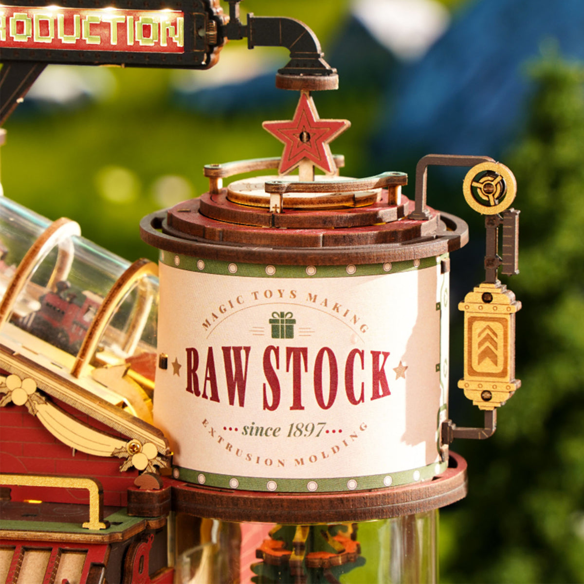 ROKR Dream Gift Factory EAB01 close-up of the Raw Stock cylindrical tower with vintage label red star topper and scrolling rotating Christmas tree inside