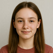 Robotime blog author headshot of Emma Collins, a young woman with long brown hair smiling in a neutral studio portrait