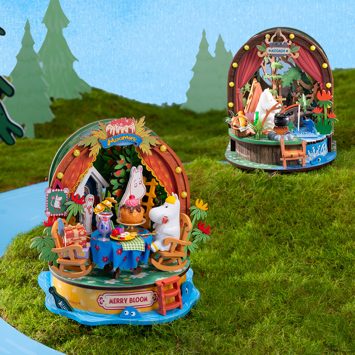 Moomintroll Forest Camp and Snorkmaiden Garden Party models displayed on grass
