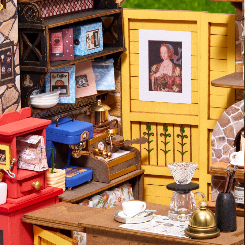 Leafree Cafe interior detail showing a red stove, blue sink, yellow door and coffee counter