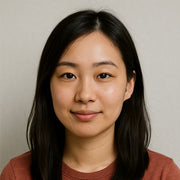 Robotime blog author headshot of Lena Zhang, a young woman with dark shoulder-length hair smiling in a neutral studio portrait