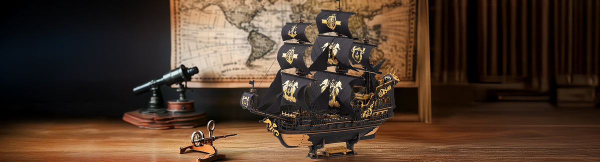 ROKR Seahorse Barque MCB02 PC banner, black and gold pirate sailing ship model displayed on a dark wood table with vintage map backdrop