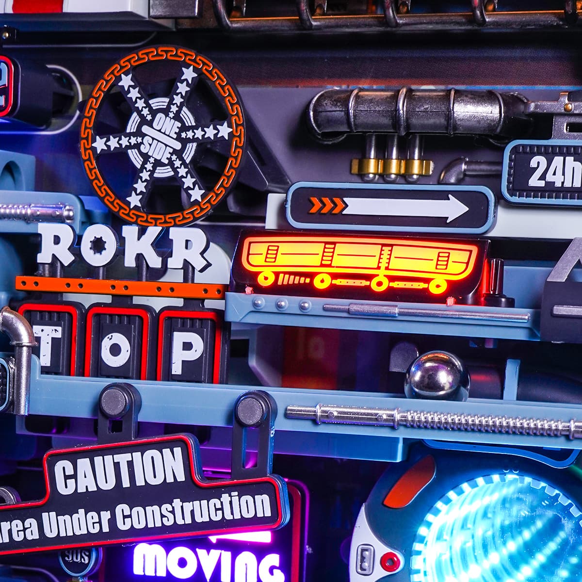 ROKR Parallel World Marble Run MR02S close-up of the neon-lit ROKR TOP sign and spinning gear wheel with caution warning sign details