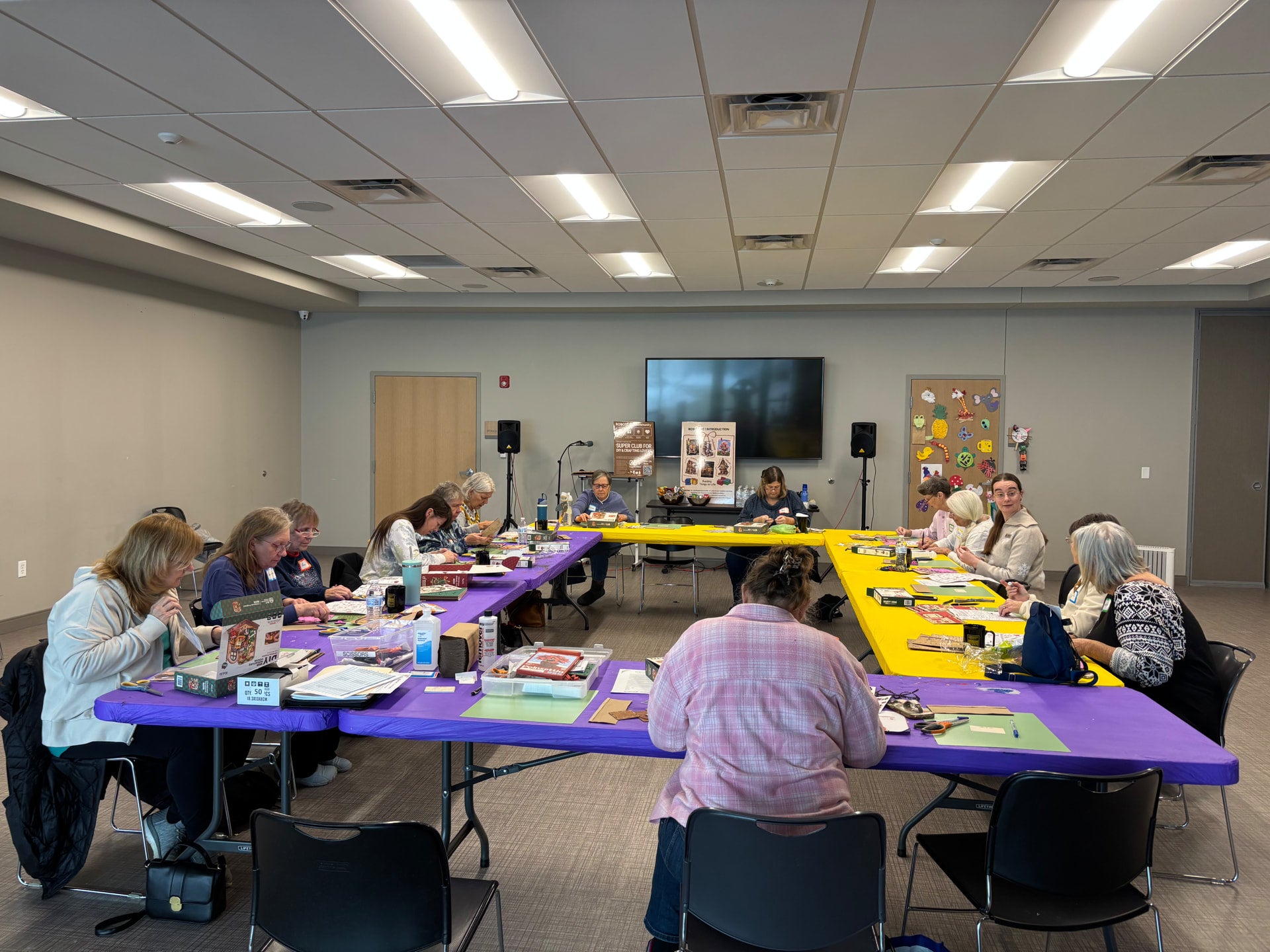 Robotime Participants Focused on The DIY Kits in Their Hands