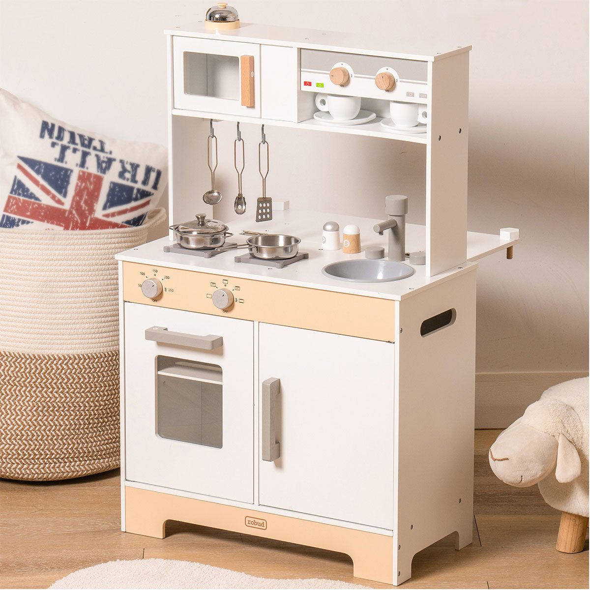 ROBUD white wooden play kitchen with chalkboard panel, upper hutch, microwave and silver accessories.