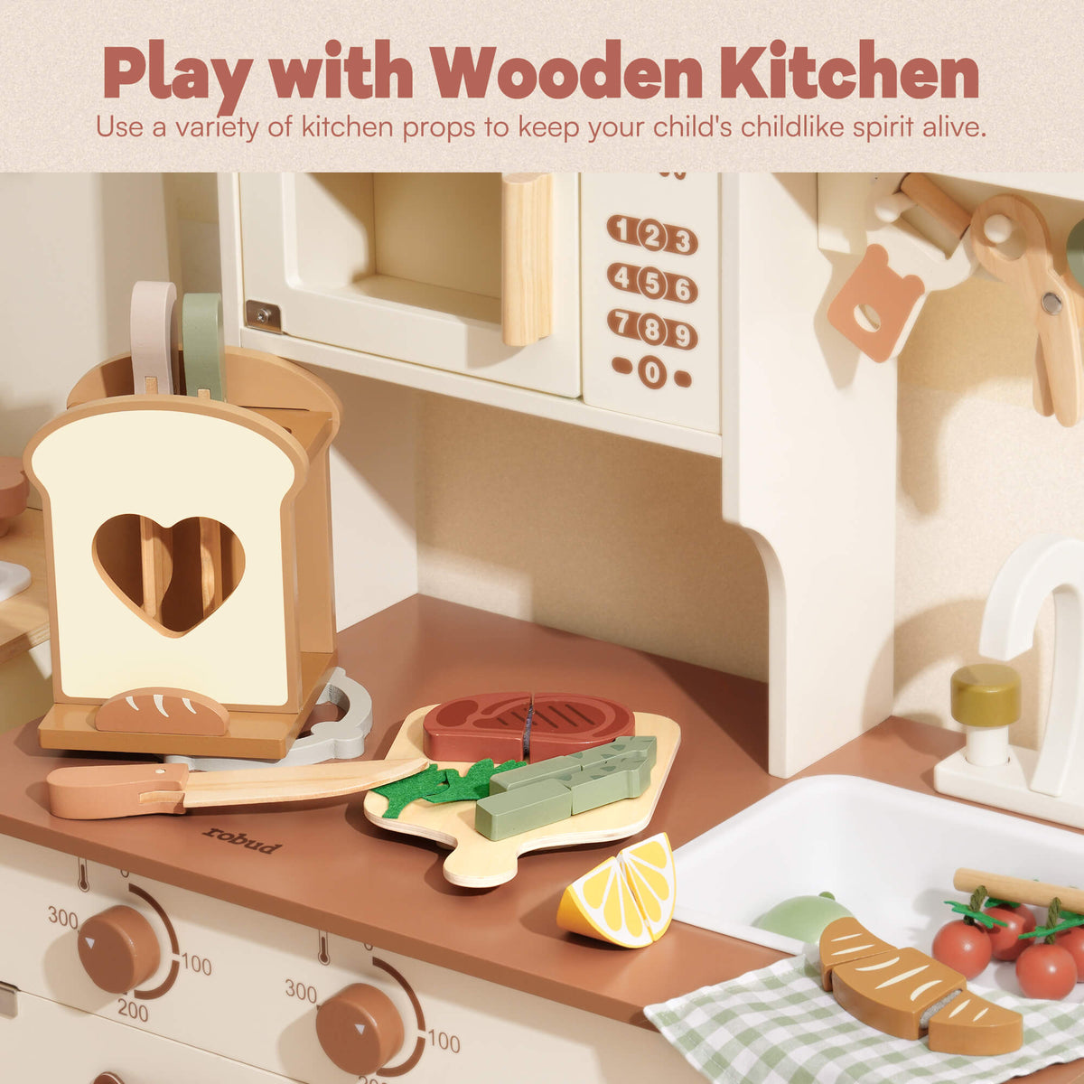 ROBUD toy kitchen brown countertop scene with heart-shaped toast holder, steak on cutting board, lemon halves and green felt garnish beside a toy oven with number panel