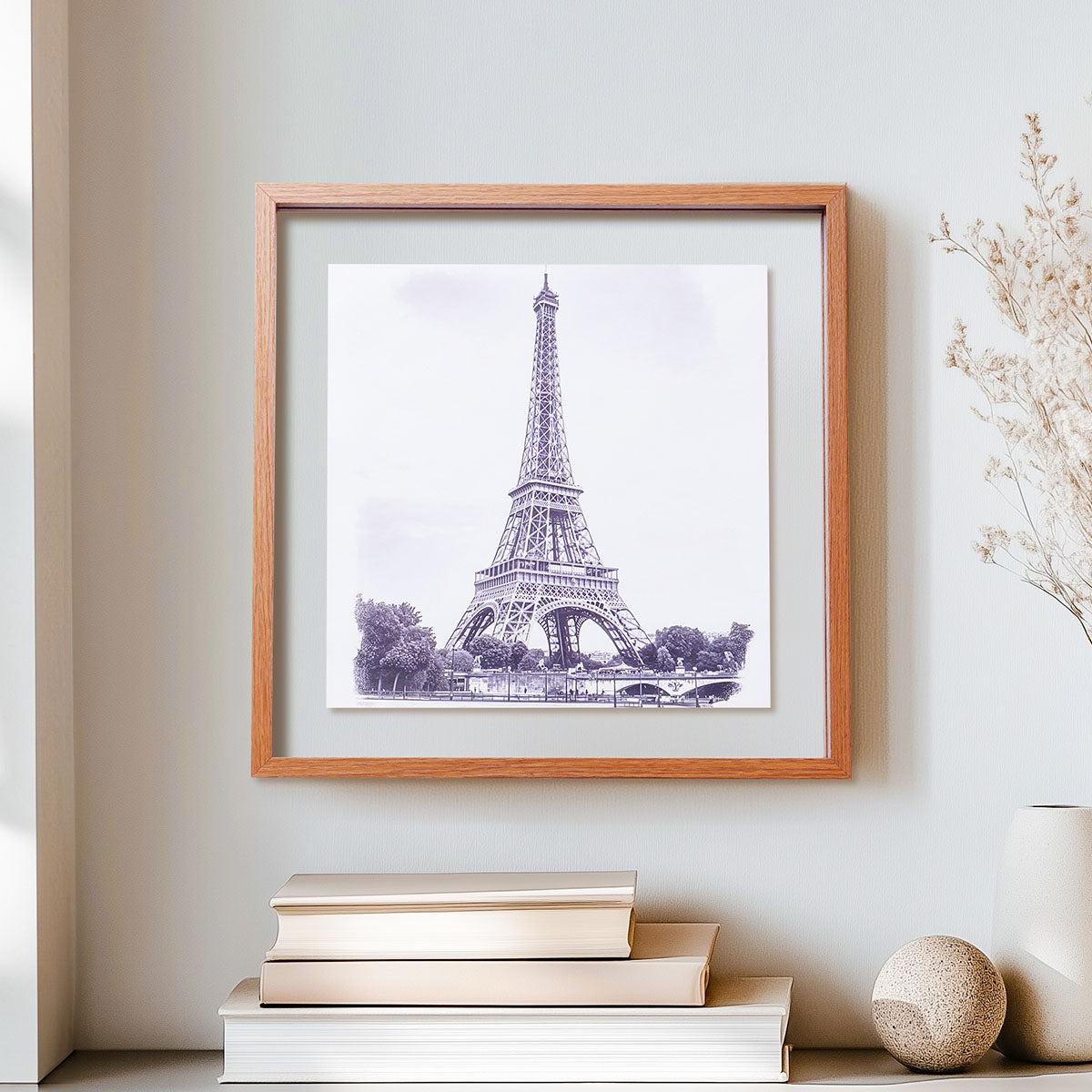 Robotime Double Glass Picture Frame WD6001 wall-mounted on a light grey wall with Eiffel Tower artwork floating between clear acrylic panels in a neutral home interior