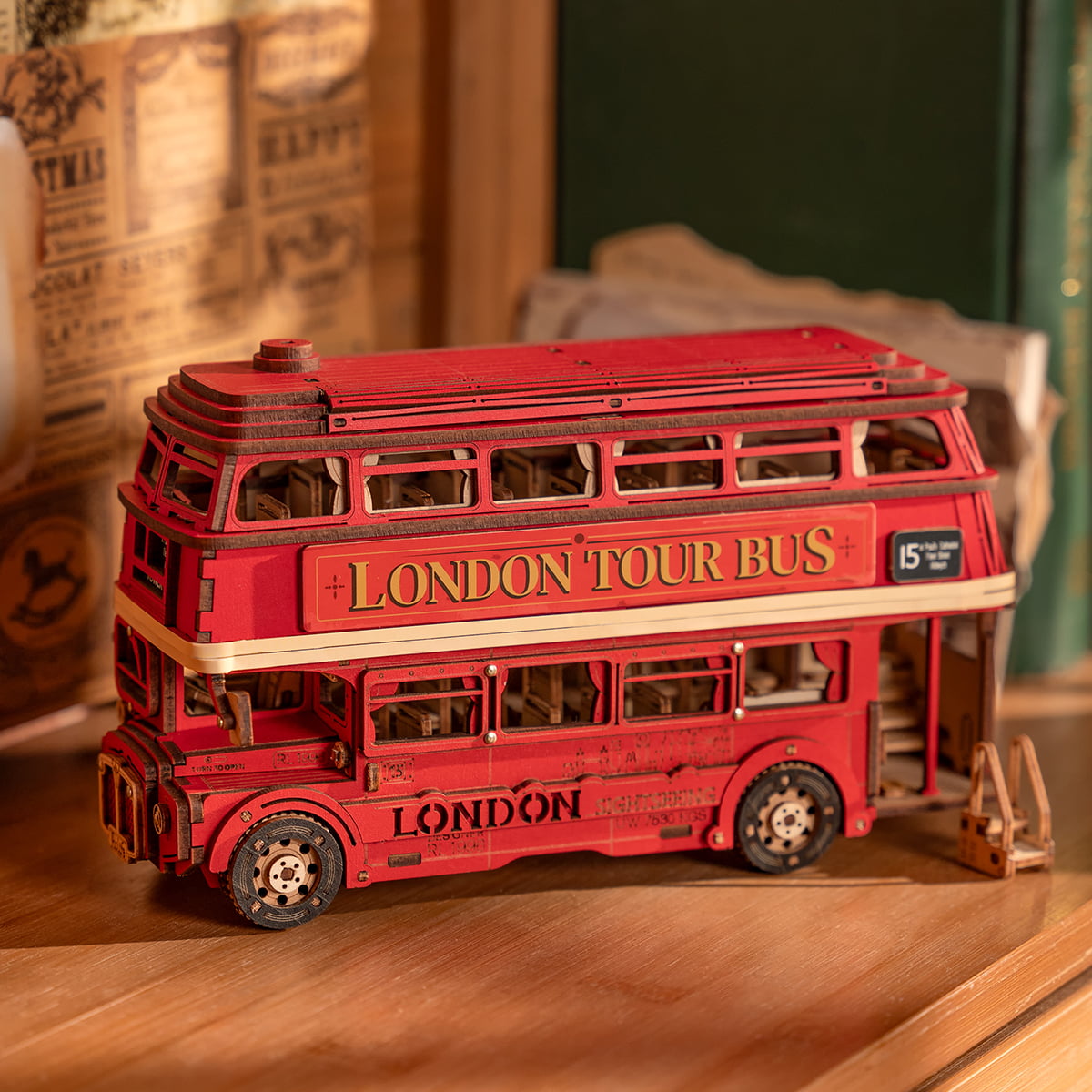 Rolife London Tour Bus red double-decker wooden puzzle model on wooden shelf with vintage newspaper backdrop