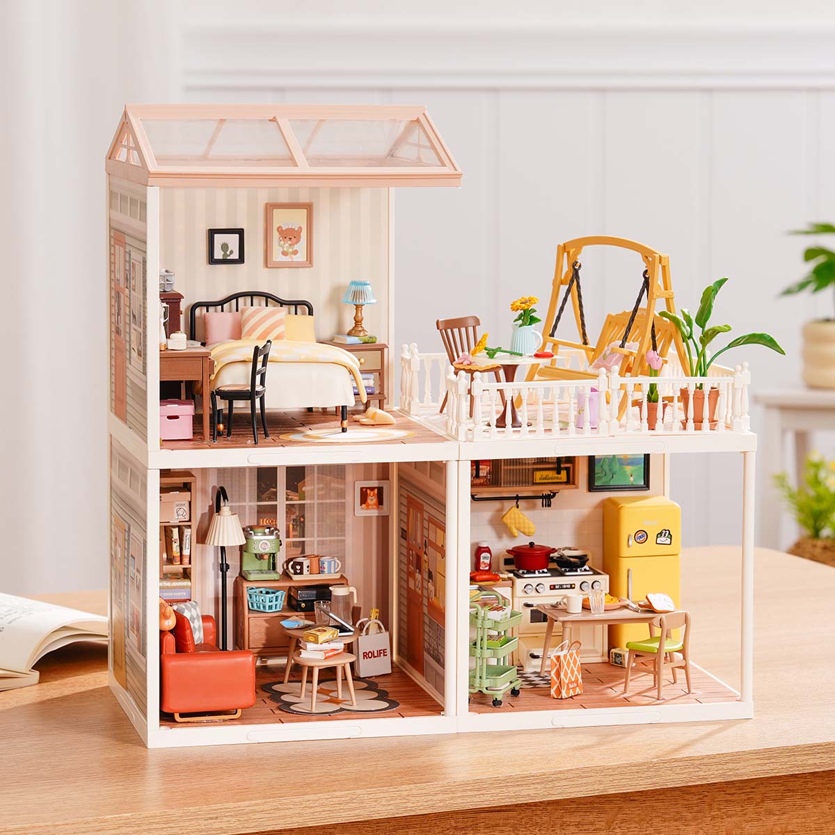 Rolife Super Creator Series 3-in-1 L Shape miniature with bakery shop and cafe terrace side by side and a burger restaurant plus Rolife Bar in the lower row on a table.