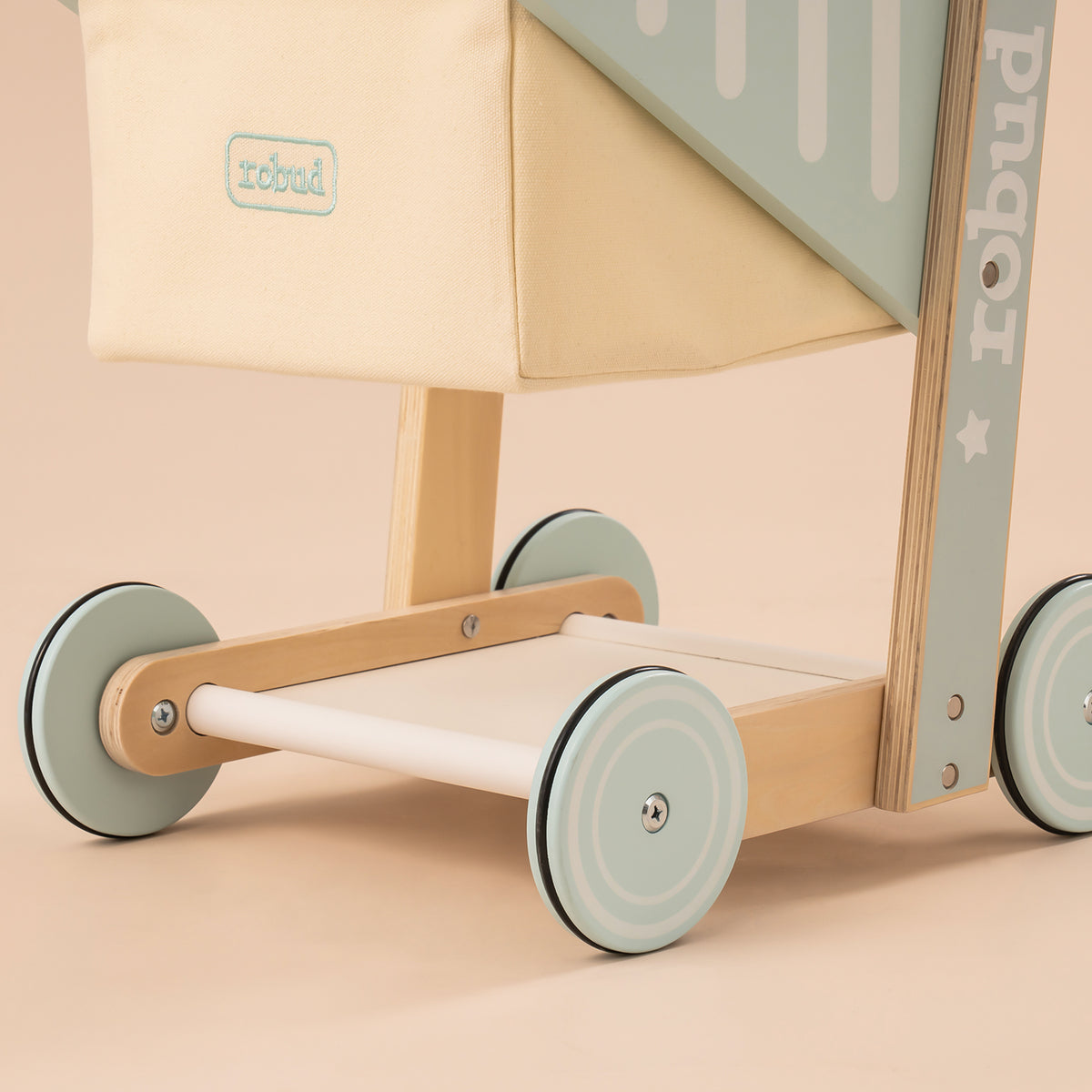 ROBUD wooden baby push walker WRP02 wheel and base close-up showing sage green spokes and natural wood base frame