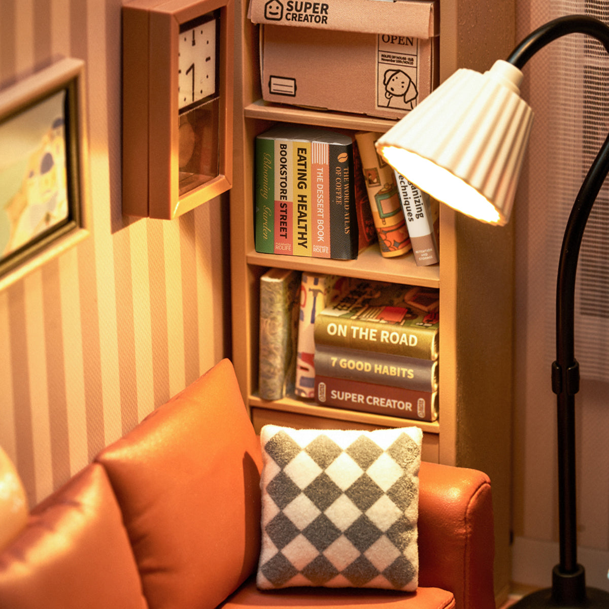 Rolife Cozy Living Lounge DW007 miniature bookshelf detail with tiny books including On the Road and warm floor lamp