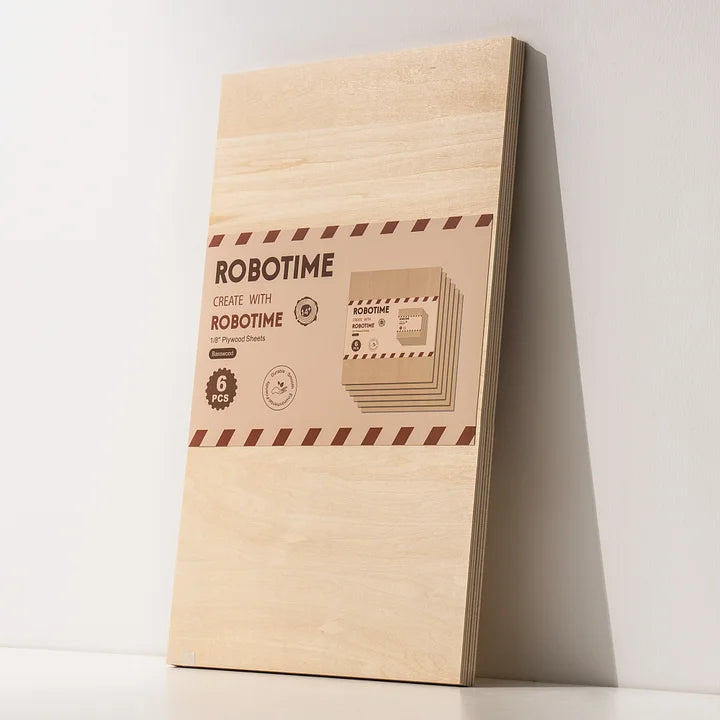 Robotime narrow rectangular pale birch plywood sheet with branded red label at lower center, leaning against white wall