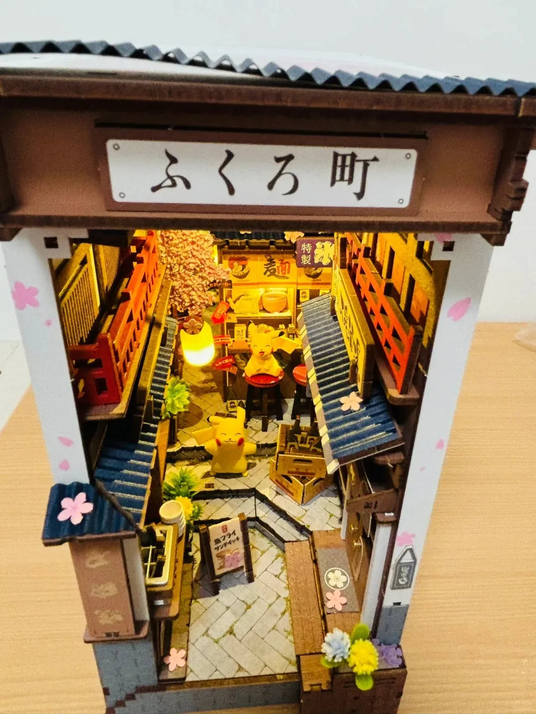 Rolife Sakura Wine Alley TGB11 book nook viewed from the front entrance arch showing the full depth of the Japanese alley with lantern and ramen shop signs