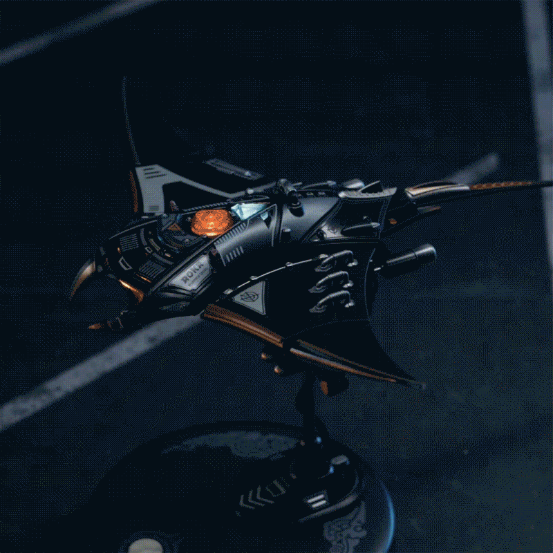 ROKR Manta Ray MI06 animated GIF showing the assembled mechanical manta ray model viewed from above on a dark display stand
