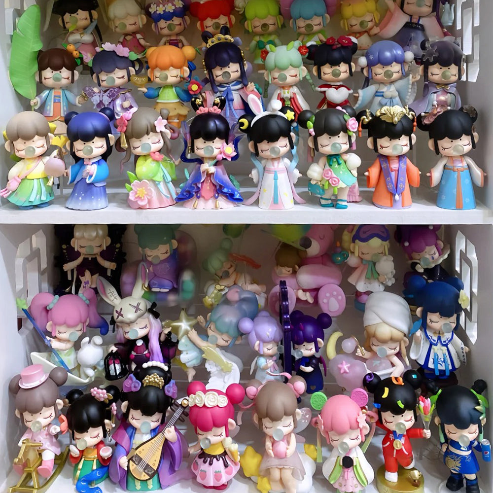 Two shelves displaying a large Rolife surprise figure doll collection in traditional costumes